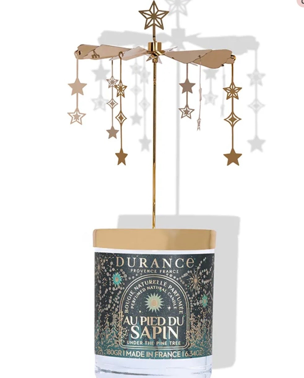Carrousel bougie au pied du sapin
