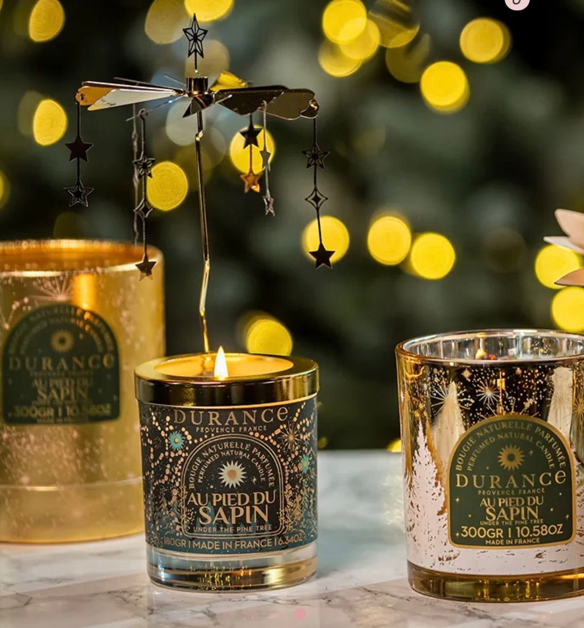 Carrousel bougie au pied du sapin